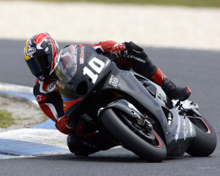 Motorcycle curve leaning person helmet - a person free wallpaper