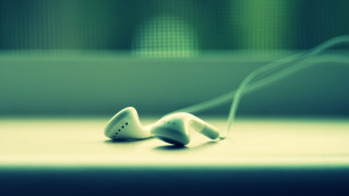 Ear buds table blurry window - a green wall free wallpaper