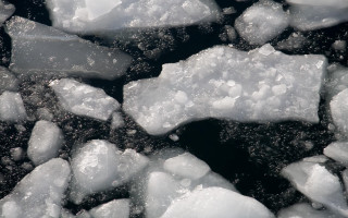 Ice chunks black surface water 2 - white bubble free wallpaper