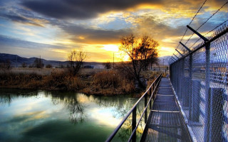 Fenced area water sunset clouds - digital photography free wallpaper