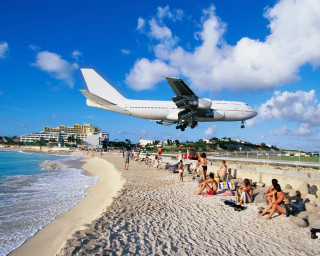 Plane beach people sand water 2 - over a beach free wallpaper