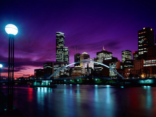 City skyline bridge light pole - a purple sky in the background free wallpaper