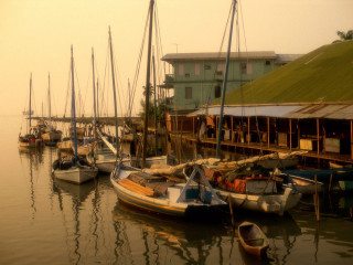 Boats water building grass roof - ektachrome photograph free wallpaper for desktop