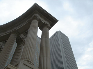 Tall building large pillars sky 5 - an art deco sculpture free wallpaper