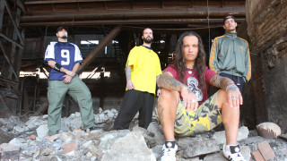 Men standing building rubble rocks - biomechanical free wallpaper