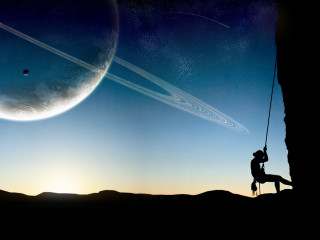 Man swinging rope planet saturn - a planet free wallpaper