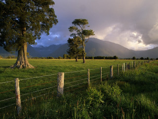Fence field tree mountains clouds 2 - in a field free wallpaper for desktop