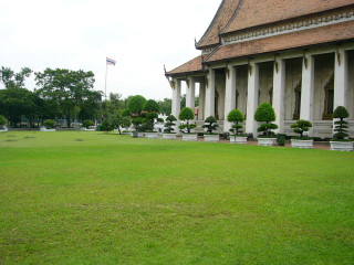 Grassy field building flagpole trees 3 - asai chū free wallpaper