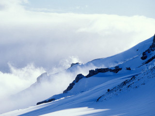 Skiing person mountain clouds background 2 - a mountain free wallpaper for desktop