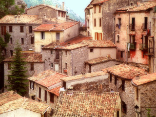 Cityscape clocktower rooftops mountain bridge - a view of a city free wallpaper