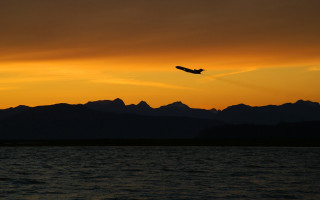 Plane flying water sunset mountains 2 - over the water free wallpaper