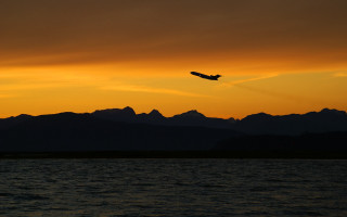 Plane flying water sunset mountains 3 - over the water free wallpaper