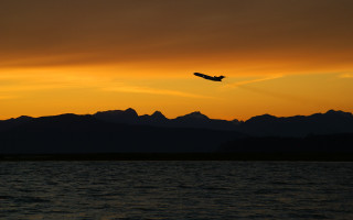 Plane flying water sunset mountains 4 - over the water free wallpaper