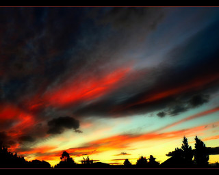 Sunset red blue sky clouds 3 - a few house free wallpaper