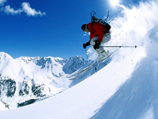 Skier mid air snowy mountain 2 - winter free wallpaper
