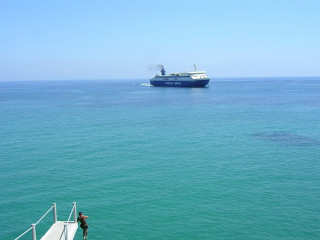 Man dock large boat ocean - filter free wallpaper