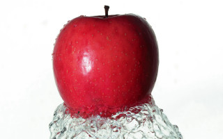 Red apple floating water side 2 - top of a piece free wallpaper