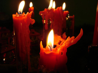 Lit candles on table dark - candle free wallpaper