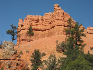 Rock formation trees blue sky - a large rock formation free wallpaper for desktop