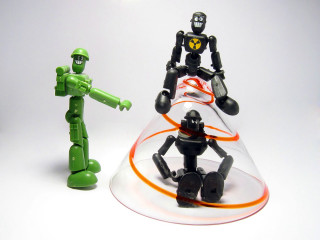 Toy figures group white surface - robot free wallpaper for desktop