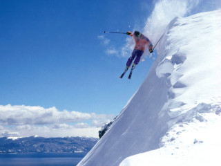 Man flying skis snow mountain - ski free wallpaper