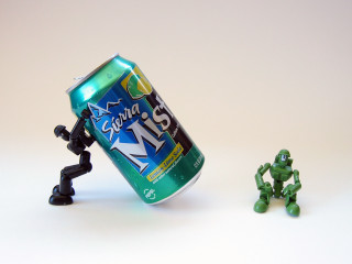 Soda toy figure white surface - a can of soda free wallpaper