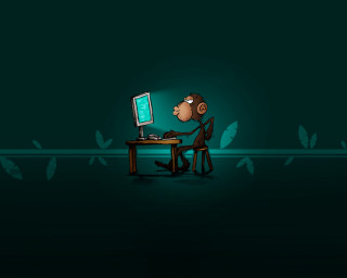 Cartoon monkey sitting desk computer 3 - a monitor free wallpaper