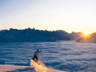 Snowboarder air clouds mountains sunset 4 - fabien charuau free wallpaper