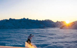 Skiing sunset mountain clouds distance - below them free wallpaper