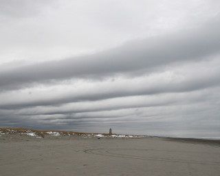 Kite beach cloudy lighthouse person 2 - a kite free wallpaper