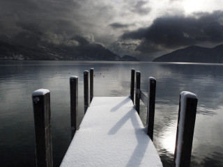 Snow covered dock lake mountains - dark cloud free wallpaper