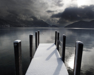 Snow covered dock lake mountains 3 - dark cloud free wallpaper