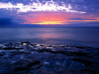 Sunset ocean rocky shore water 2 - a rocky shore free wallpaper