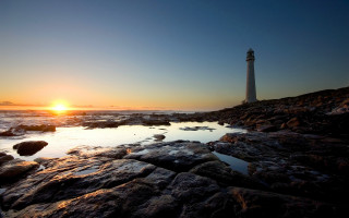 Lighthouse rocky shore sunset sun 4 - the background and the water free wallpaper