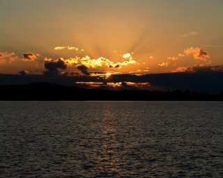 Sunset over water clouds boat - the sky and a boat free wallpaper