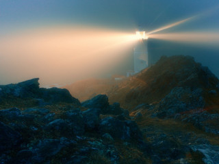 Lighthouse rocky cliff foggy sky 4 - a rocky cliff free wallpaper