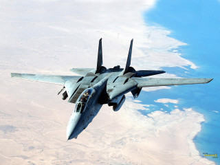 Fighter jet flying water sky - over a large body of water free wallpaper