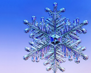 Snowflake blue sky background middle - a snowflake free wallpaper