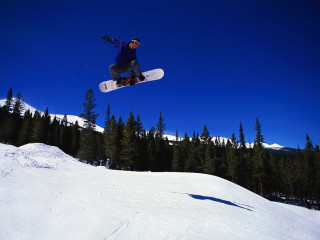 Snowboarder air trick snow trees - kodachrome free wallpaper