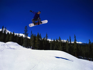 Man flying snowboard slope forest - a snowboard free wallpaper