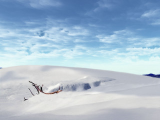 Skiing snowy hill sky background - a mountain in the distance free wallpaper