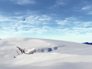 Person skiing snowy hill sky - a mountain in the distance free wallpaper