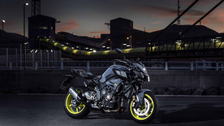 Motorcycle parked night bridge background - a motorcycle free wallpaper