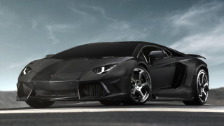 Black sports car driving down - a black sports car free wallpaper