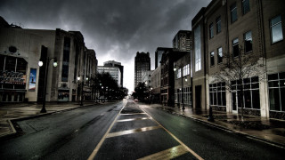 City street dark sky buildings - gloomy atmosphere free wallpaper