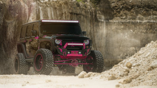 Pink jeep rocky terrain 3d - a rock wall behind free wallpaper