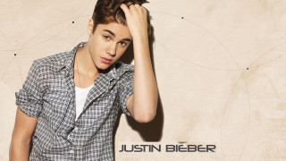 Young man posing hand on - his head free wallpaper