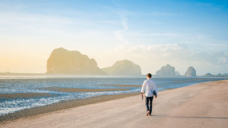 Man walking beach ocean surfboard - david boyd free wallpaper