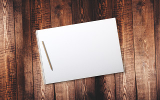 White notebook pen wooden surface - a pen free wallpaper