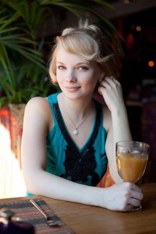 Woman sitting table orange juice 3 - portrait photography free wallpaper for mobile